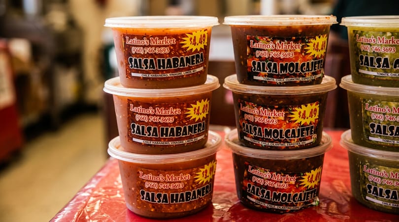Various Latino's Market salsas, including Habanera and Molcajete, in clear plastic containers.